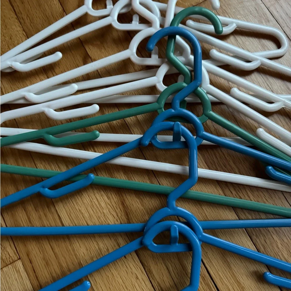 Set of Blue, Green, and White Plastic stacking Hangers